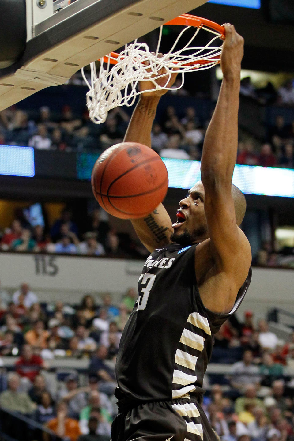 NASHVILLE, TN - MARCH 16: Da'Quan Cook #43 of the St. Bonaventure Bonnies dunks the ball against the Florida State Seminoles during the second round of the 2012 NCAA Men's Basketball Tournament at Bridgestone Arena on March 16, 2012 in Nashville, Tennessee. (Photo by Kevin C. Cox/Getty Images)