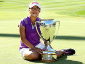 The Kiwi up and comer poses with her trophy after winning the 2013 Canadian Women's Open at The Vancouver Golf Club.