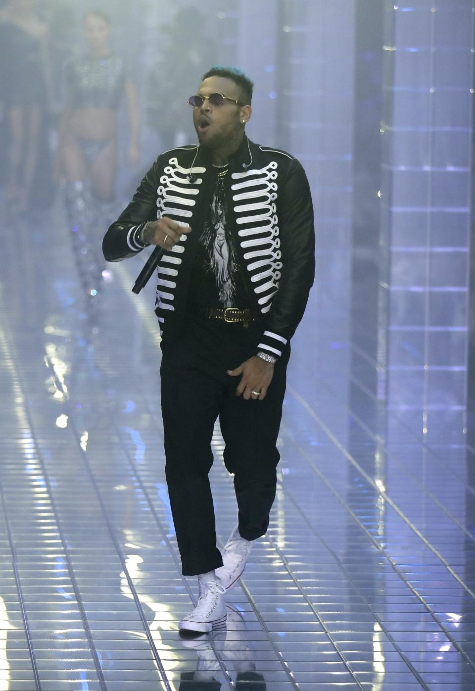 FILE - In this Sept. 21, 2018 file photo, US rapper Chris Brown performs during Philipp Plein's women's 2019 Spring-Summer collection, unveiled during the Fashion Week in Milan, Italy. The lawyer for a woman who filed a rape complaint in Paris against Brown says the American rap artist "has thumbed his nose at and shown disrespect for the French legal system" after he did not attend a formal confrontation with the alleged victim in Paris on Tuesday, May 28, 2019. (AP Photo/Luca Bruno, files)