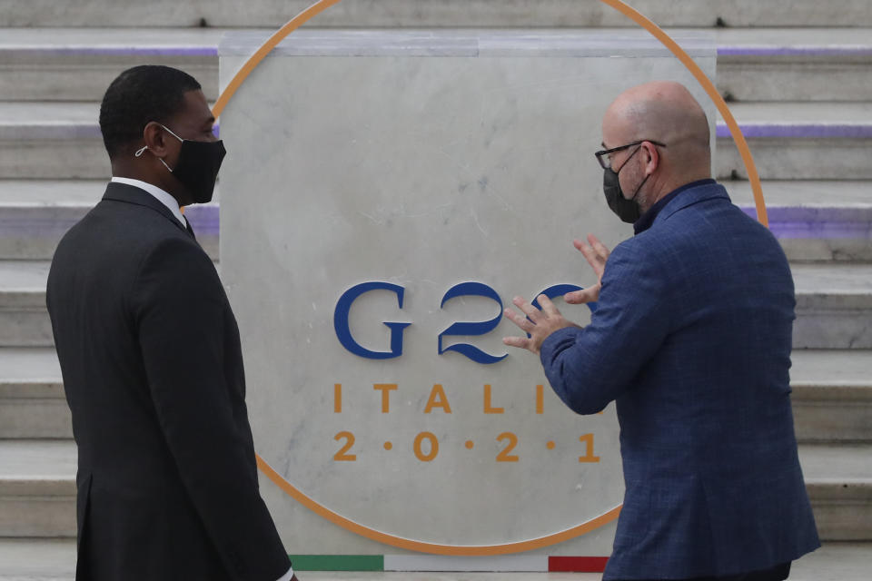 Administrator of the Environmental Protection Agency Michael Stanley Regan, left, is welcomed by Italian Minister for Ecological Transition Roberto Cingolani as he arrives at Palazzo Reale in Naples, Italy, Thursday, July 22, 2021, to take part in a G20 meeting on environment, climate and energy. (AP Photo/Salvatore Laporta)