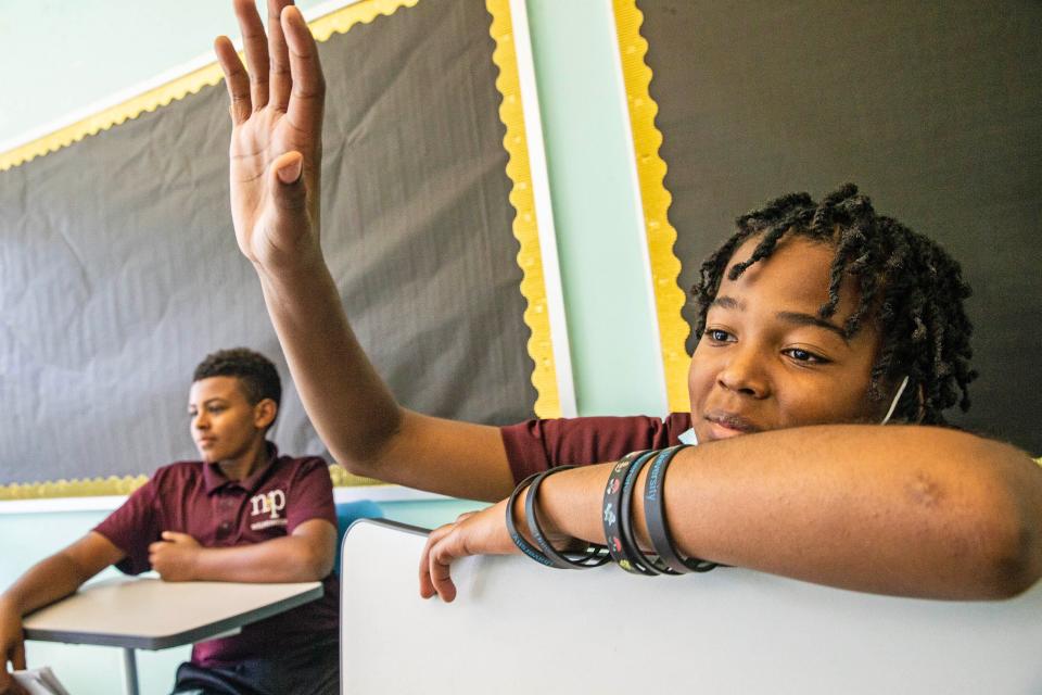 Student Raleir Tate, 12, has a question for the panel during the career day event hosted by Nativity Preparatory School of Wilmington on its 20th Anniversary, Wednesday, Oct. 25, 2023. Nativity Prep is an all-boy Catholic school that provides tuition-free education for students coming from underserved communities and hosts career day to expose its students to different career paths.