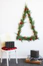 <p>Who says that a Christmas tree has to be placed on the floor? To really turn heads (and save space), craft an alternative tree that pretties up a wall instead. We love the natural look of the real greenery and berries too. </p><p><strong>Get the tutorial at <a href="http://oleanderandpalm.com/2016/11/modern-triangle-wall-christmas-tree.html" rel="nofollow noopener" target="_blank" data-ylk="slk:Oleander + Palm;elm:context_link;itc:0;sec:content-canvas" class="link ">Oleander + Palm</a>.</strong></p><p><a class="link " href="https://www.amazon.com/Darice-Floral-Paddle-Gauge-Green/dp/B0026HY2TU/ref=sr_1_3?tag=syn-yahoo-20&ascsubtag=%5Bartid%7C10050.g.28872053%5Bsrc%7Cyahoo-us" rel="nofollow noopener" target="_blank" data-ylk="slk:SHOP FLORAL WIRE;elm:context_link;itc:0;sec:content-canvas">SHOP FLORAL WIRE</a></p>