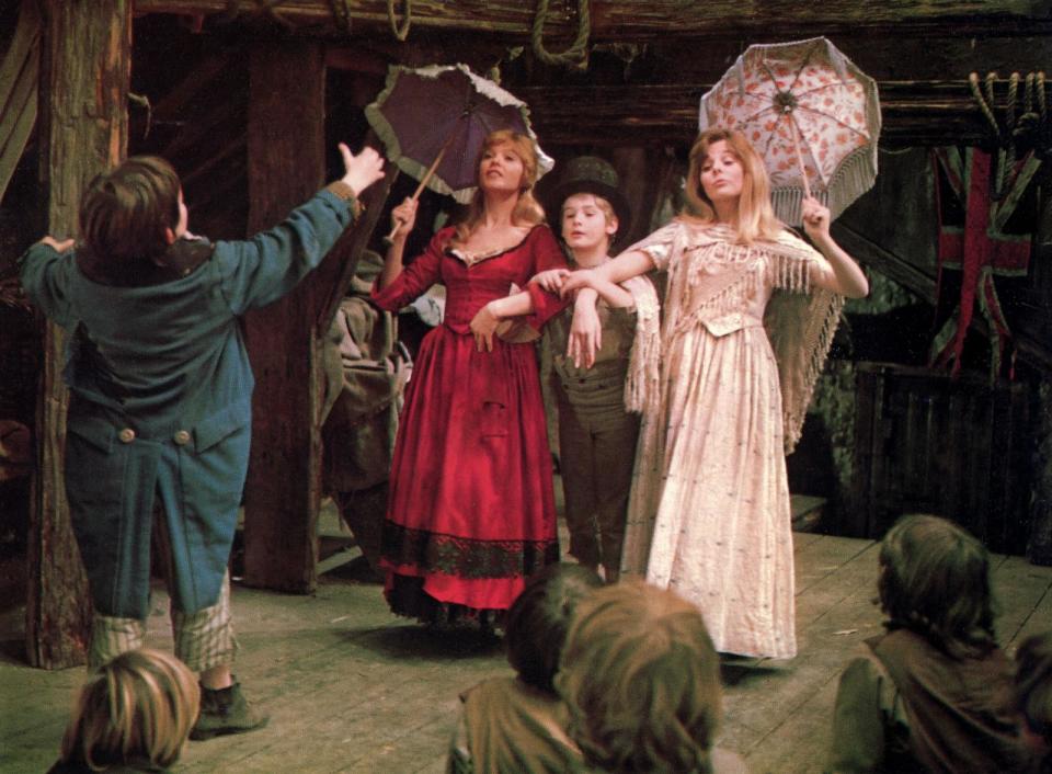 PHOTO: Jack Wild, Shani Wallis, Mark Lester, and Sheila White, appear in the 1968 British musical film, 'Oliver!' (Glasshouse Images/Shutterstock)