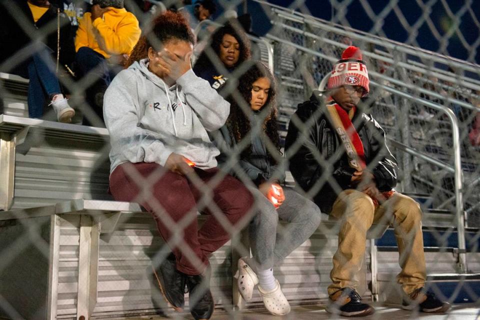 Family, friends and community members listen to prayers during a candlelight vigil in honor of three Gautier High School graduates at Gautier High School in Gautier on Thursday, Dec. 7, 2023. Se’Dhari Saniya Watson-Person, Kyla “Muffin” Watkins, and Tatyanna Richmond were involved in a fatal crash on Tuesday, leading to the deaths of Watson-Person and Watkins.