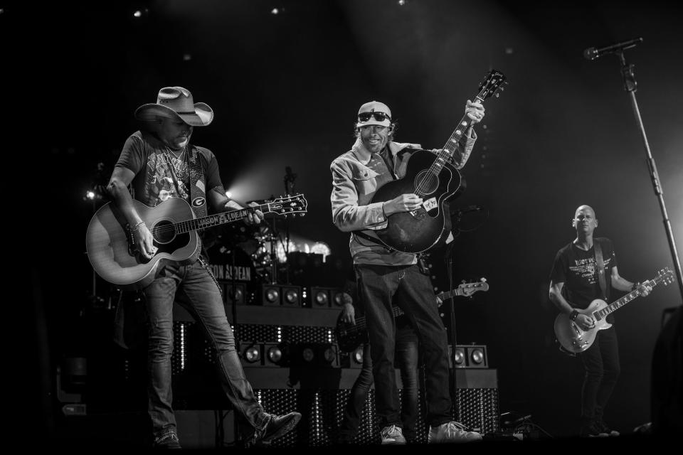 Toby Keith, right, makes a surprise appearance at Jason Aldean's sold-out "Highway Desperado Tour" stop Oct. 13, 2023, at Paycom Center in downtown Oklahoma City.