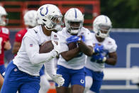 Indianapolis Colts running back Jonathan Taylor runs a drill during practice at the NFL team's football training camp in Westfield, Ind., Wednesday, July 28, 2021. (AP Photo/Michael Conroy)