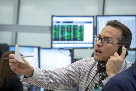 A trader works at the New York Stock Exchange February 5, 2015. REUTERS/Brendan McDermid