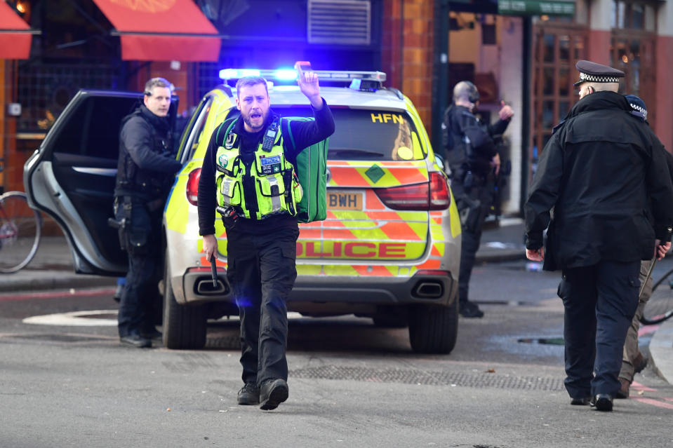 Police instruct members of the public to move away from London Bridge and Borough Market, London.