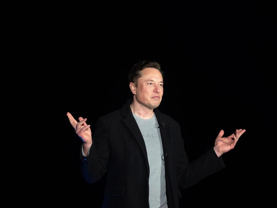 Elon Musk gestures as he speaks during a press conference at SpaceX's Starbase facility near Boca Chica Village in South Texas on February 10, 2022.