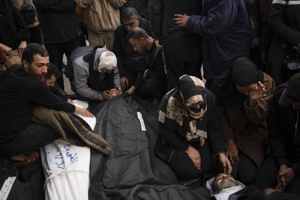 Palestinians mourn relatives killed in the Israeli bombardment of the Gaza Strip at a hospital morgue in Rafah, Monday, March 4, 2024. (AP Photo/Fatima Shbair)