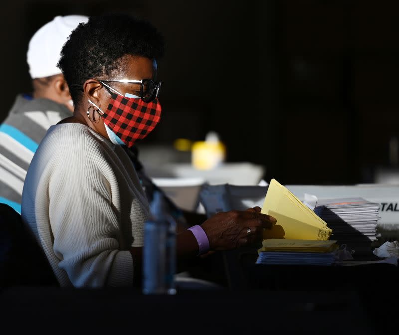 Employees of the Fulton County Board of Registration and Elections process ballots in Atlanta