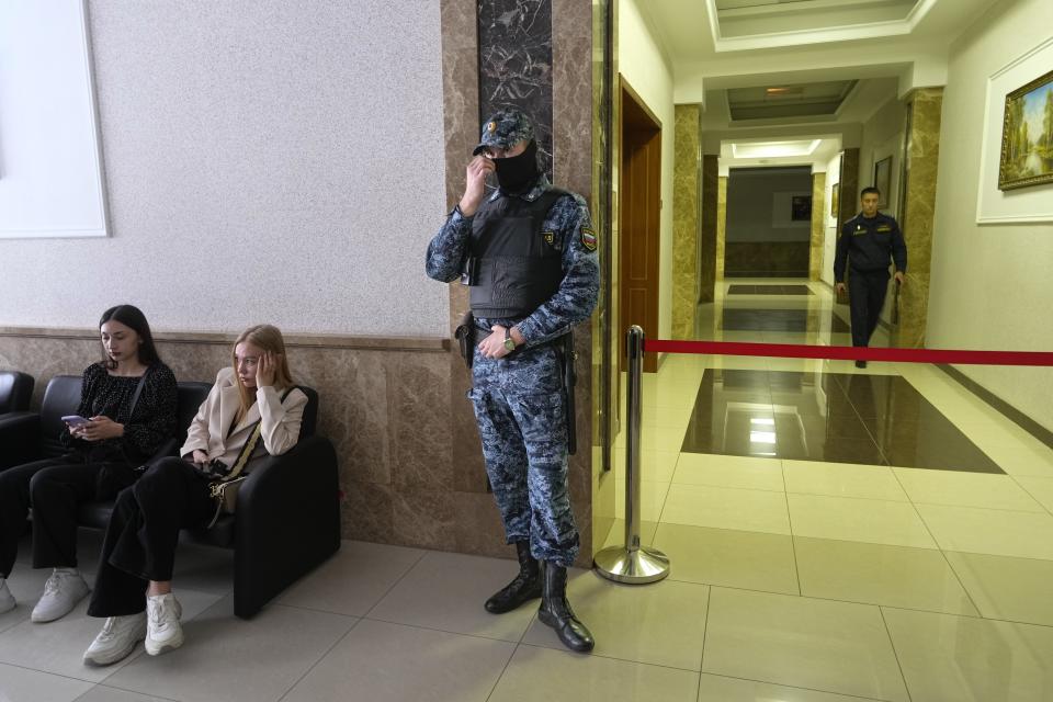 A Russian Federal Bailiffs Service employee guards a corridor leading to a courtroom inside the court in Yekaterinburg, Russia, Thursday, July 18, 2024, during a hearing of Wall Street Journal reporter Evan Gershkovich's suspected spying activities. (AP Photo/Dmitri Lovetsky)