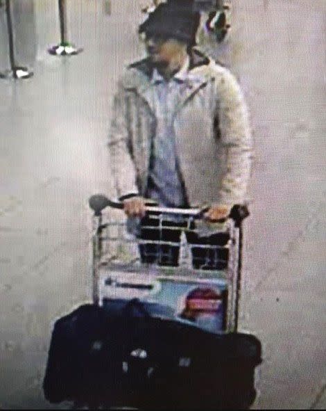 A CCTV picture shows a bespectacled man, believed to be Islamic State commander Najim Laachraoui, pushing a trolley with a large black bag. Photo: Getty Images