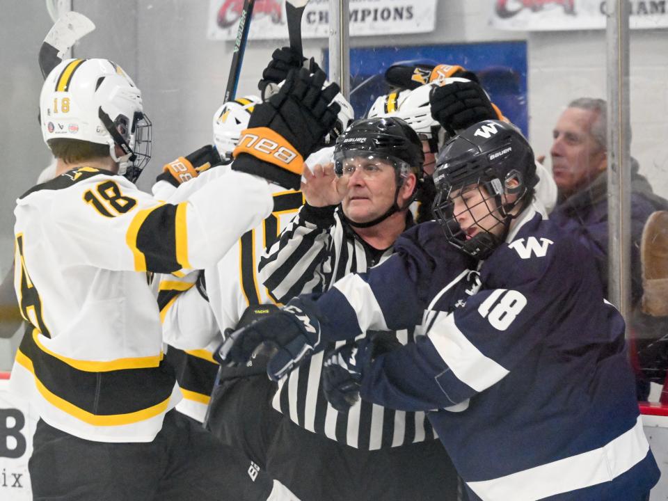 The referee separates Canton Jenkinson of Nantucket who was enveloped with the celebration of a Nauset goal.