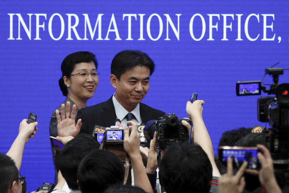 Yang Guang, spokesman of the Hong Kong and Macau Affairs Office of the State Council, gestures as reporters approach him after a press conference about the ongoing protests in Hong Kong, at the State Council Information Office in Beijing, Monday, July 29, 2019. Yang said some Western politicians are stirring unrest in Hong Kong in hopes of creating difficulties that will impede China’s overall development. (AP Photo/Andy Wong)