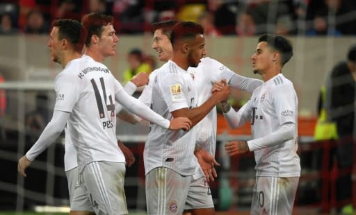 Bayern Munich's Brazilian midfielder Philippe Coutinho (R) celebrates scoring in Saturday's 4-0 win at Fortuna Duesseldorf