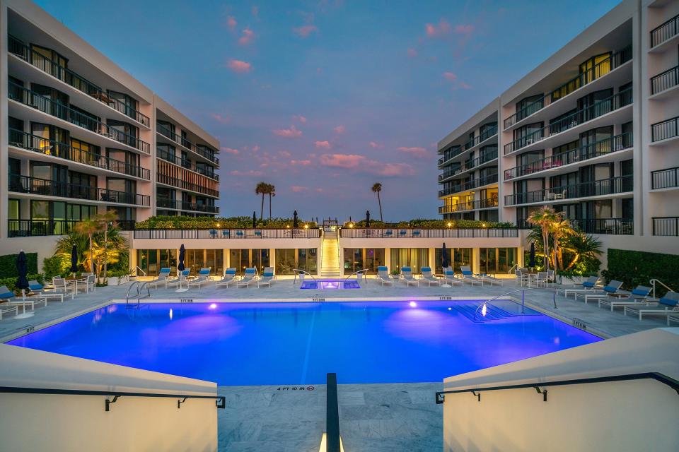 The recently updated pool and patio areas at Carlton Place are flanked by the condominium buildings.