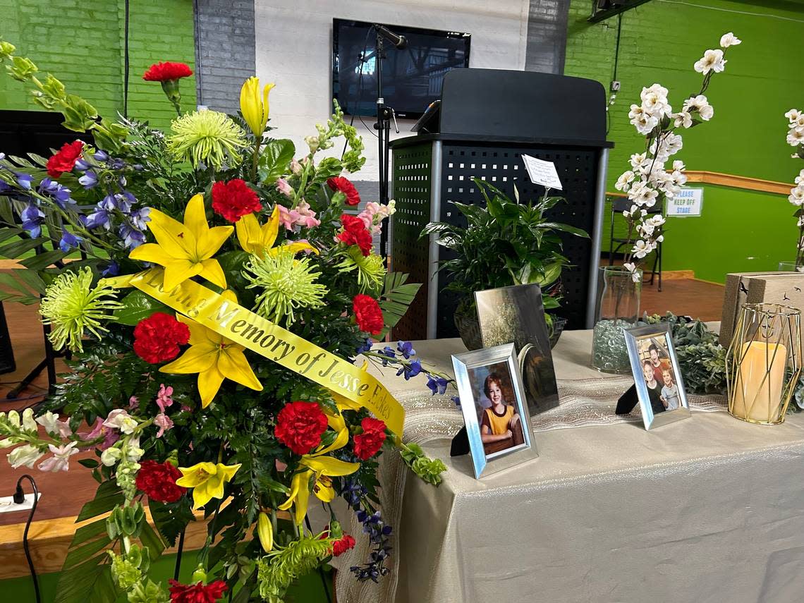 A table in front of the stage at Hope Faith memorializes Jesse Eckes, 52, whom loved ones remember as generous and kind.