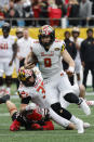 Maryland quarterback Billy Edwards Jr. carries the ball against North Carolina State during the first half of the Duke's Mayo Bowl NCAA college football game in Charlotte, N.C., Friday, Dec. 30, 2022. (AP Photo/Nell Redmond)