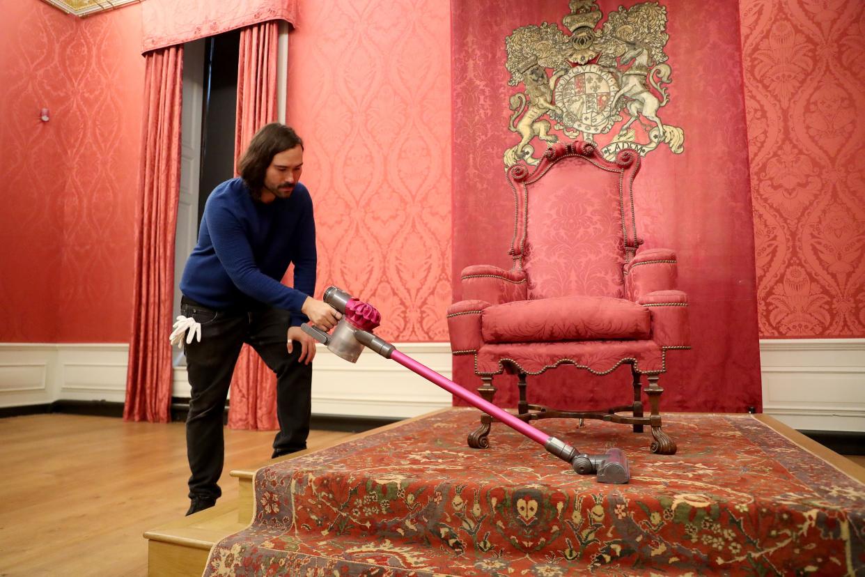 A Historic Royal Palace conservator cleans the King's Presence Chamber ahead of the re-opening of Kensington Palace to the public tomorrow on July 29, 2020, in London, England.