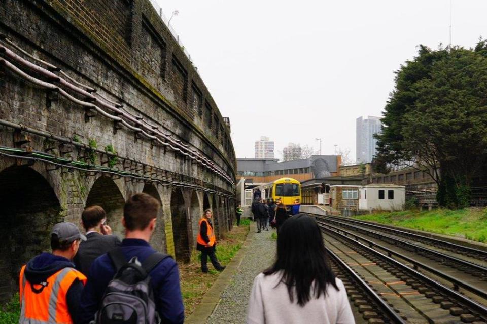 Evacuated: Passengers walking alongside the tracks after abandoning the train: Stefan Jakubowski