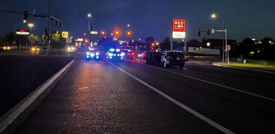 Law enforcement vehicles block the southbound lanes of Columbia Center Boulevard and Quinault Avenue Sunday night after a suspect in a stolen car crashed near the Kennewick intersection. Courtesy BCSO