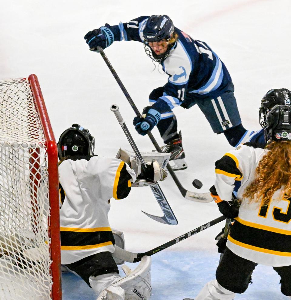 Darby Rounesville of Sandwich prepares a shot on Nauset goalie Olivia Avellar.