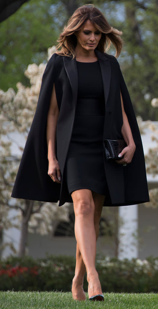 The first lady wore a gorgeous Givenchy cape for the French president’s arrival. (Photo: Getty Images)