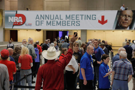 Attendees wait to enter the convention hall where the National Rifle Association (NRA) will hold its annual meeting in Dallas, Texas, U.S., May 4, 2018. REUTERS/Lucas Jackson
