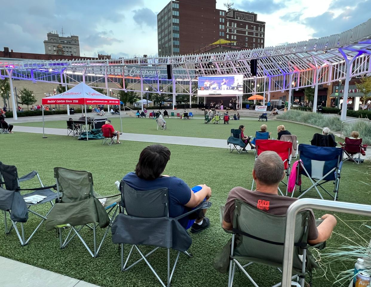 Concertgoers watch a band perform on the first day of the Downtown Canton Music Fest at Centennial Plaza. The event is not returning this summer.
