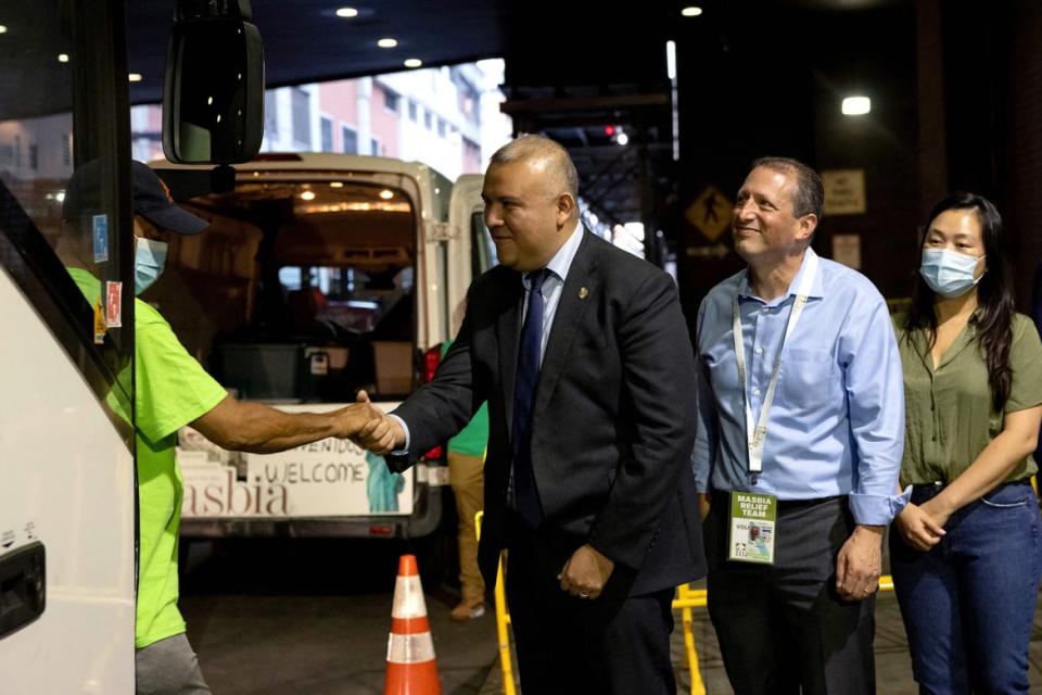 <div class="inline-image__caption"><p>New York Immigrant Affairs Commissioner Manuel Castro shakes hands with a group of migrants, who boarded a bus in Texas, as they arrive at Port Authority Bus Terminal in New York City on Aug. 25, 2022.</p></div> <div class="inline-image__credit">Yuki Iwamura/AFP via Getty Images</div>