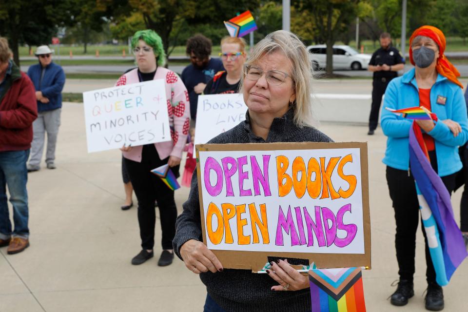 Demonstrators gathered in Dearborn, Mich., to protest banning of books.