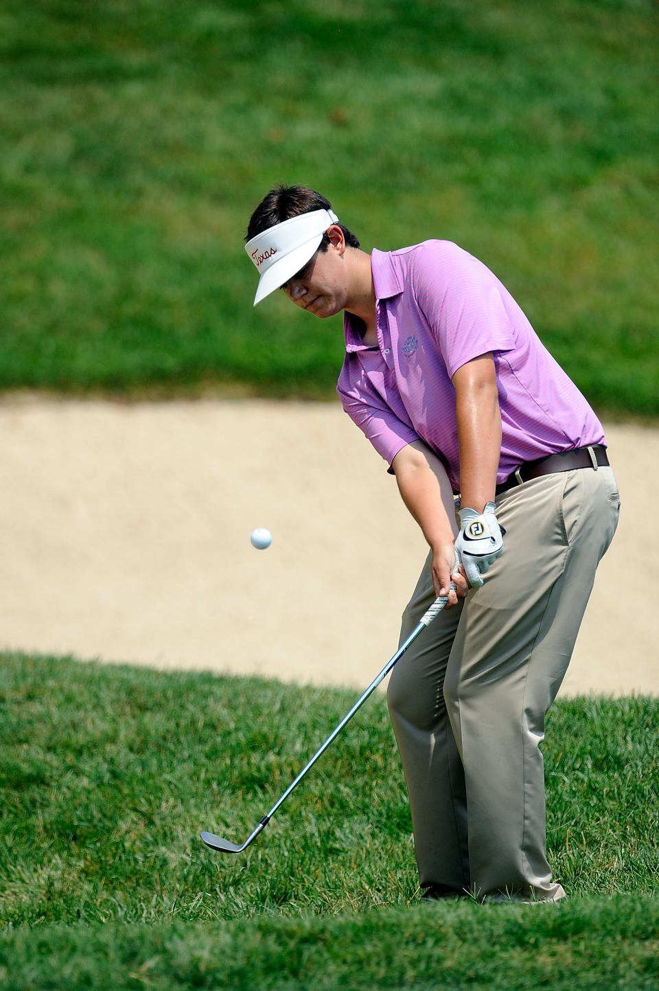 Amateur Beau Hossler chips from the rough on the second green during Round Two of the AT&T National at Congressional Country Club on June 29, 2012 in Bethesda, Maryland. (Photo by Patrick McDermott/Getty Images)