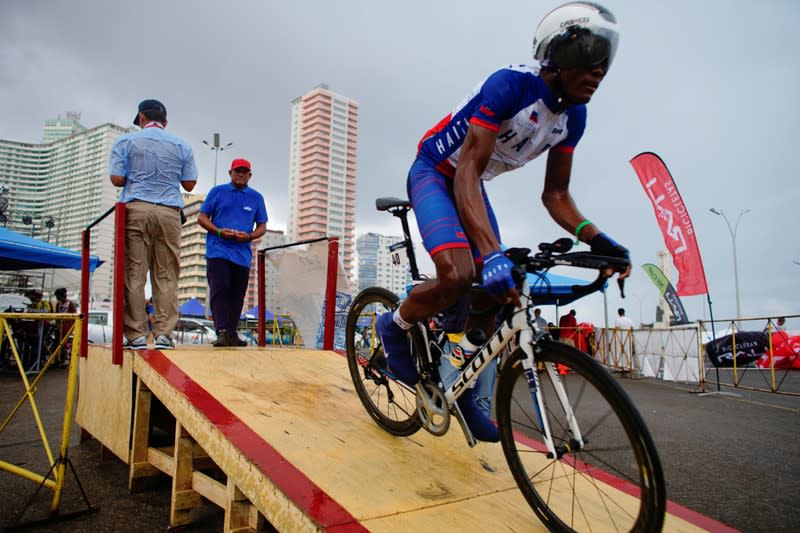 The Wider Image: Haiti's cyclists brave protests and poor roads in race for gold