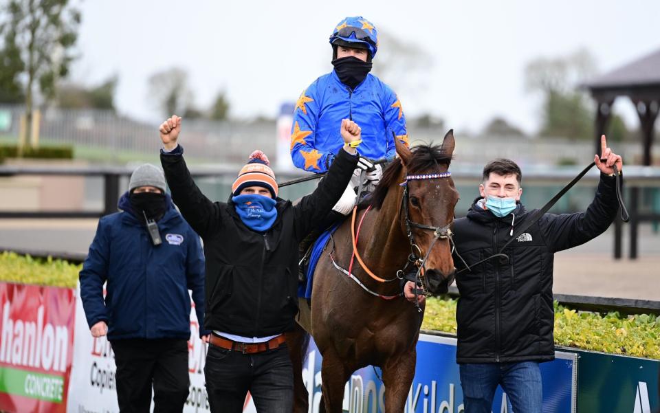 Dreal Deal ridden by jockey Denis O'Regan (centre) with owner & trainer Ronan McNally (left) and son Tiernan after winning the Sky Bet Moscow Flyer Novice Hurdle (Grade 2) at Punchestown Racecourse, County Kildare, Ireland.  - PA