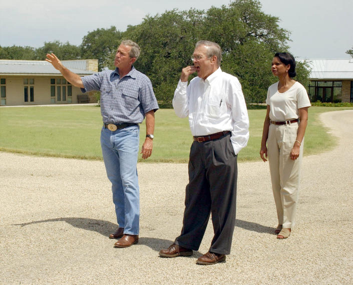 <b>George W. Bush: mom jeans</b> The former commander in chief stands with former Secretary of Defense Donald Rumsfeld and ex-National Security Advisor Condoleezza Rice near Bush's ranch house in Texas in 2003. And away from the White House seems to mean a more lax dress code. (Photo by Rod Aydelotte-Pool/Getty Images)