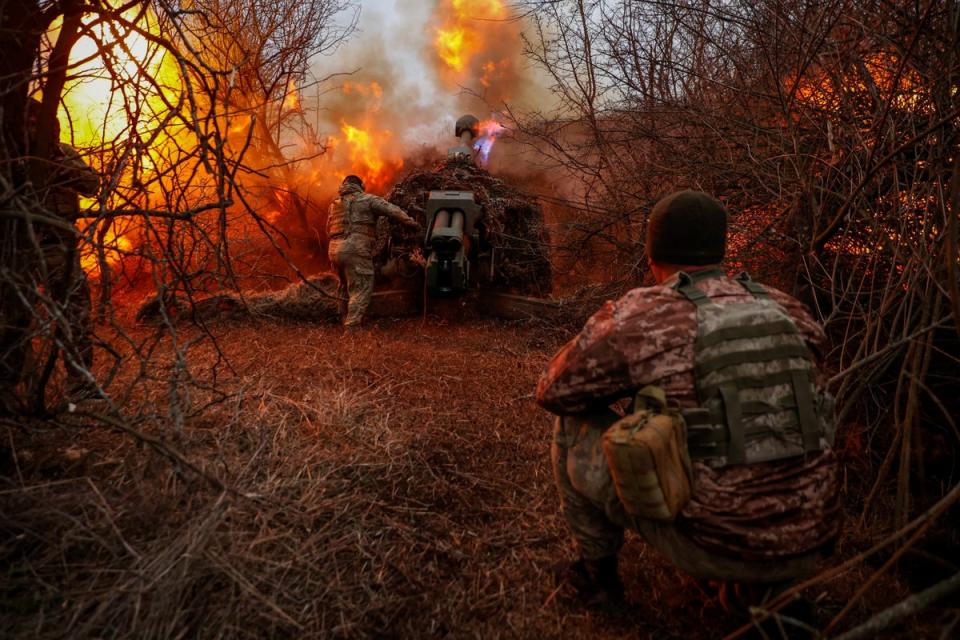 Ukrainian servicemen of the 126th Separate Territorial Defence Brigade fire a D-30 howitzer towards Russian troops at a position on a front line in Kherson region (Reuters)