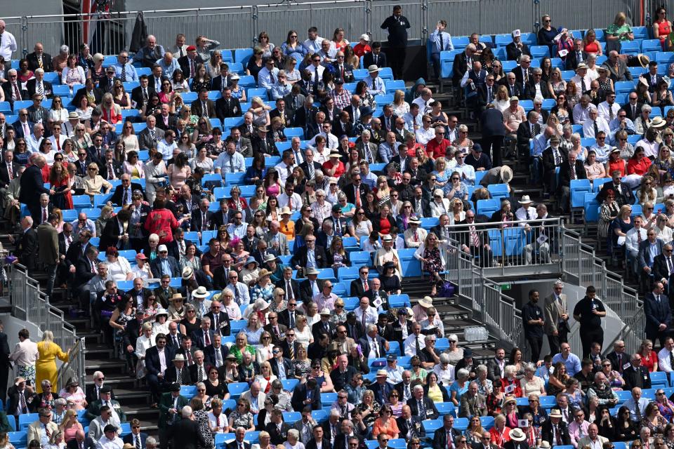 Members of the public in the stands watching the parade (PA)