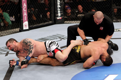 Rousimar Palhares (R) puts Mike Massenzio (L) into a leg lock to win a 2012 bout. (Getty)