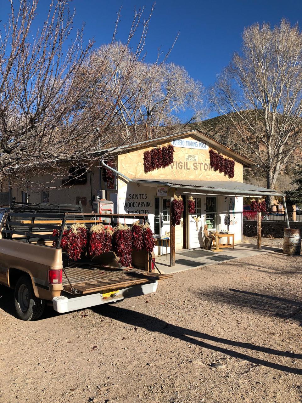 Still in Chimayo, New Mexico. We bought some hanging ristras of red chile pods. Ristras are said to bring both good health and good luck to those who hang them at their door. I put one on the door of my Parisian shop. Just behind that shop, we took some holy dirt in El Santuario de Chimayo. It attracts those who are seeking healing of body, mind, or spirit.