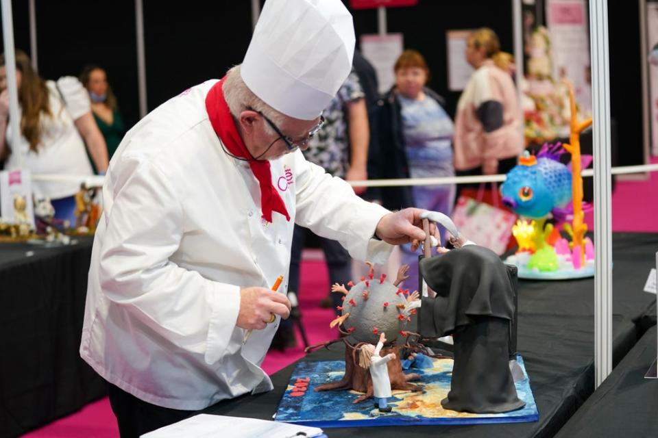 A team of judges is assessing the cakes (Jacob King/PA) (PA Wire)