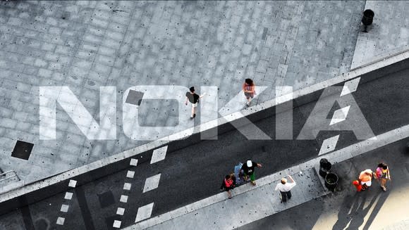 The Nokia logo overlaid on an overhead shot of a city street.