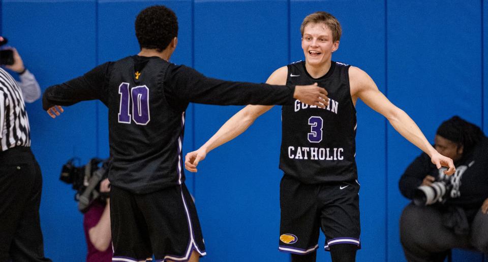 Guerin Catholic High School junior Robert Sorensen (3) and senior Kamea Chandler (10) react as time is about to expire during the second half of an IHSAA Sectional Basketball championship game against Indianapolis Bishop Chatard, Monday, March 6, 2023, at Indianapolis Shortridge High School. Guerin Catholic won 53-41.