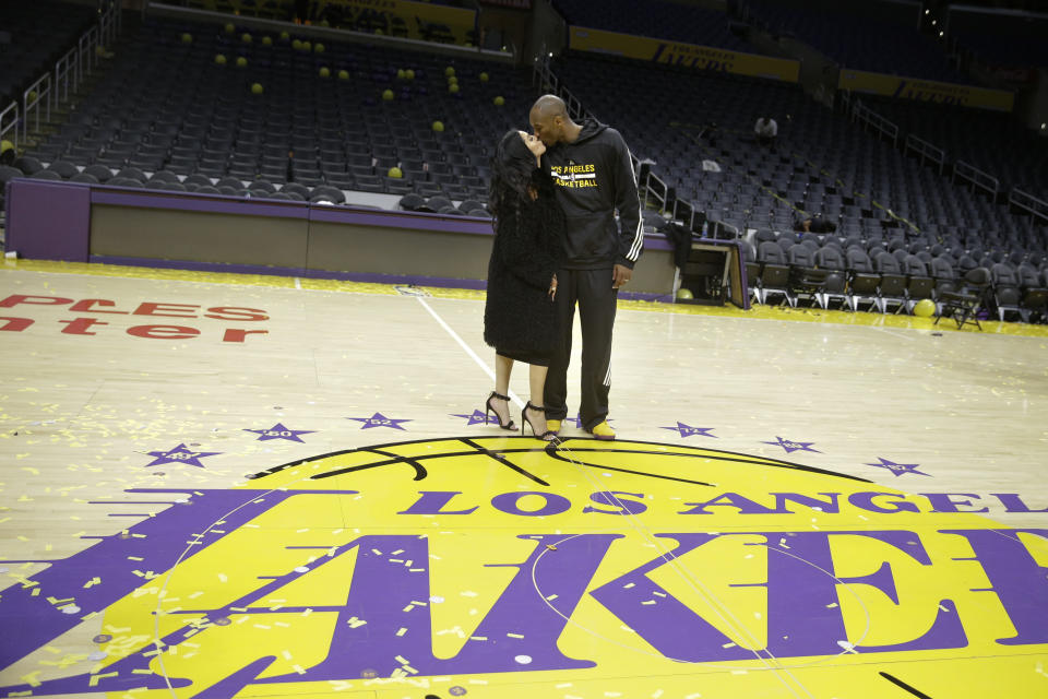 Los Angeles Lakers forward Kobe Bryant kisses his wife, Vanessa, after the last NBA basketball game of his career, against the Utah Jazz, on Thursday, April 14, 2016, in Los Angeles.