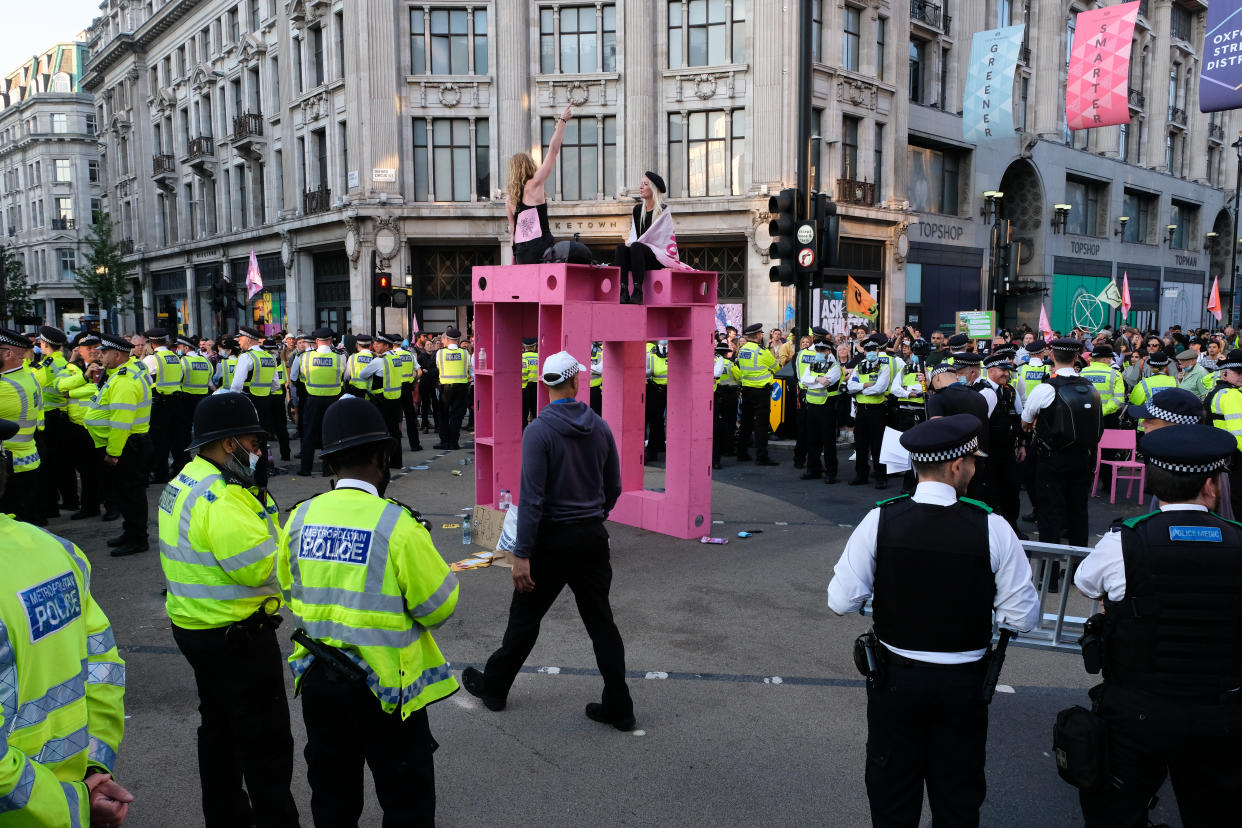 LONDON, UNITED KINGDOM - AUGUST 25, 2021 - Climate change protesters from Extinction Rebellion in Oxford Circus at the Impossible Rebellion. Protesters are arrested and carried away. (Photo credit should read Matthew Chattle/Barcroft Media via Getty Images)