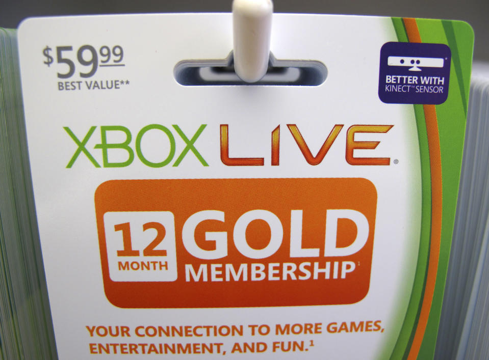 Xbox live gold membership cards are shown for sale at a Microsoft retail store in San Diego January 18, 2012. Microsoft Corp's fiscal second-quarter profit fell very slightly as lagging computer sales to cash-strapped consumers in the United States and Europe hurt its core Windows business. Picture taken January 18, 2012. REUTERS/Mike Blake (UNITED STATES - Tags: BUSINESS SCIENCE TECHNOLOGY) - GM1E81K0LOB01