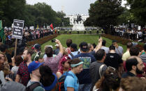 <p>Demonstrators march near the White House on the one year anniversary of the Charlottesville ‘Unite the Right’ rally, Sunday, Aug. 12, 2018, in Washington. (AP Photo/Jacquelyn Martin) </p>