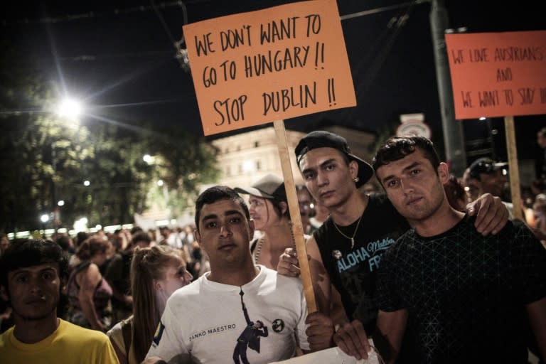 Migrants attend a rally against the ill-treatment of migrants after the bodies of 71 refugees were found in an abandoned truck last week in Vienna on August 31, 2015