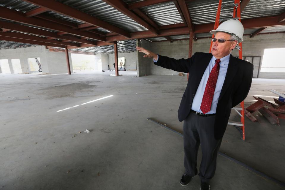 Senior Pastor David McEntire gives a tour during the expansion of First United Methodist Church in 2014. McEntire, who is retiring after 15 years, oversaw the $16 million expansion project.