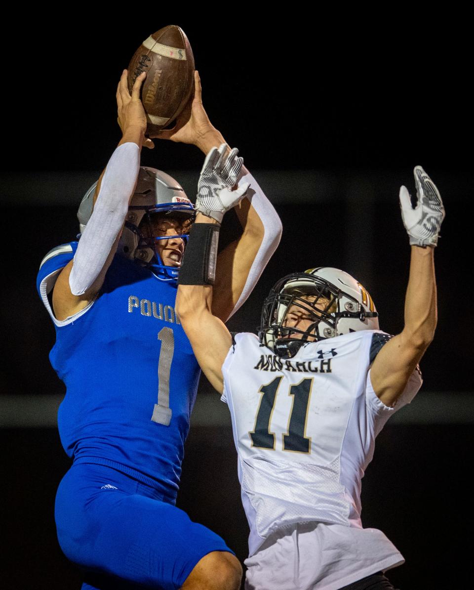 Poudre High School's Jones Thomas catches a touchdown pass over Monarch's Gavin Fagen at French Field in Fort Collins, Colo. on Friday, Sept. 23, 2022.